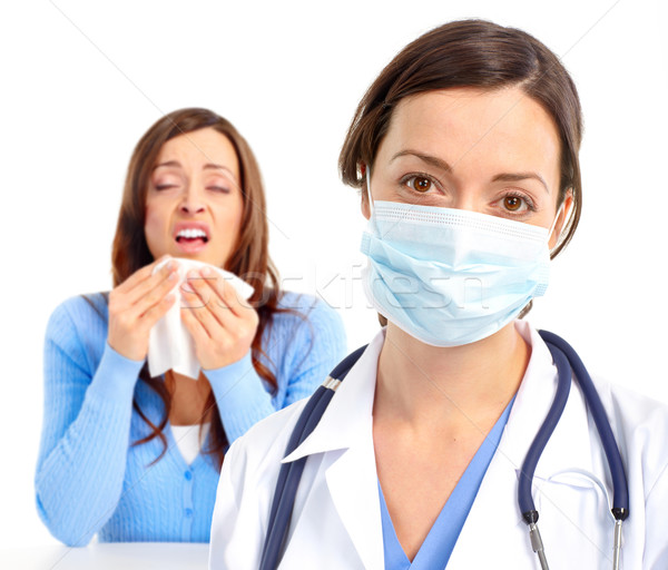 Sneezing girl and doctor. Stock photo © Kurhan
