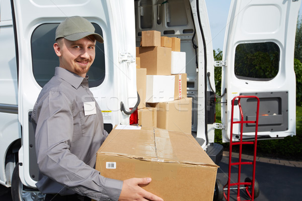 Young delivery man with a parcel. stock photo © Kurhan (#7321700) |  Stockfresh