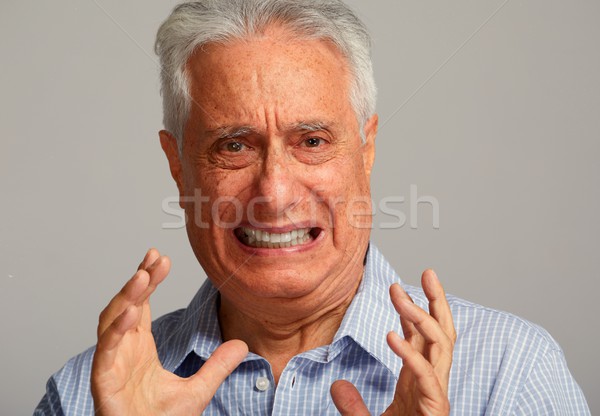 Obrzydzenie starszych człowiek twarz portret Zdjęcia stock © Kurhan