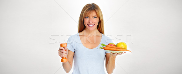 Beautiful lady with dumbbell and food Stock photo © Kurhan