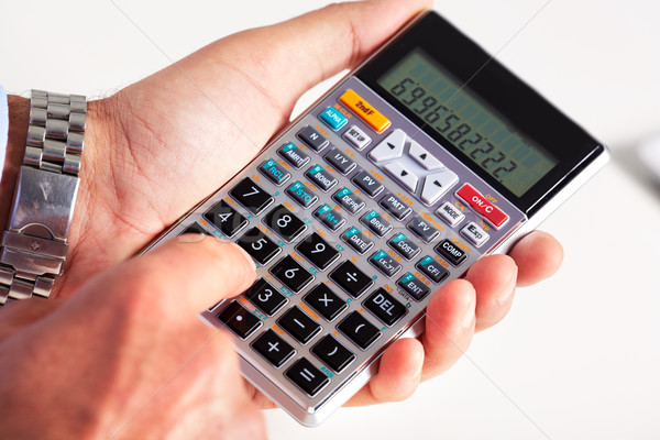 Hand with calculator. Stock photo © Kurhan