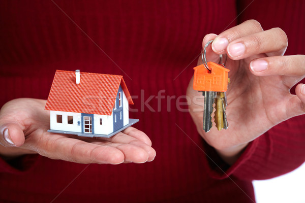 Woman Hands with little house and key. Stock photo © Kurhan