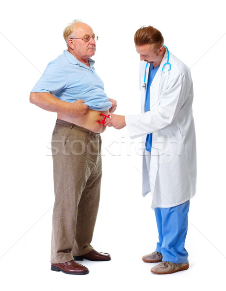 Medical doctor with body fat calipers. Stock photo © Kurhan