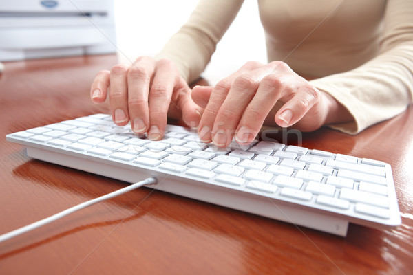Woman typing Stock photo © Kurhan