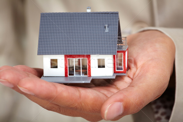 Hands with little house. Stock photo © Kurhan