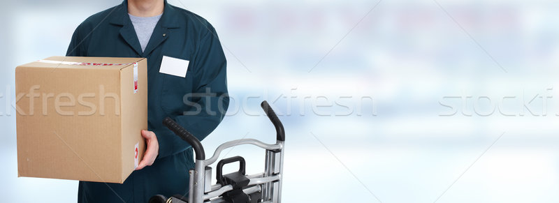 Delivery postman with a box. Stock photo © Kurhan