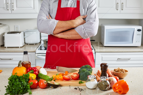 Chef man cooking in the kitchen. Stock photo © Kurhan
