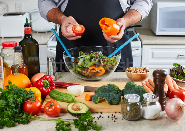 Chef man cooking in the kitchen. Stock photo © Kurhan