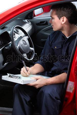 Autószerelő jóképű szerelő dolgozik autó javítás Stock fotó © Kurhan