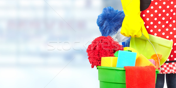 Maid hands with cleaning tools. Stock photo © Kurhan
