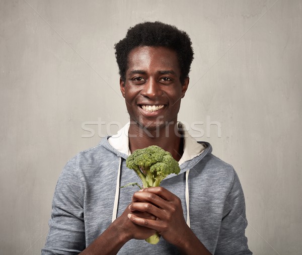 Black man with broccoli Stock photo © Kurhan