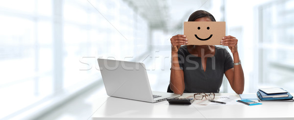 Business woman with smiling cardboard on face Stock photo © Kurhan
