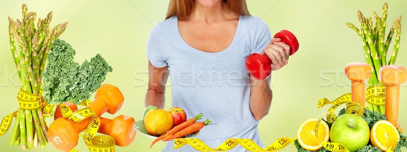 Stock photo: Healthy woman with vegetables and fruits.