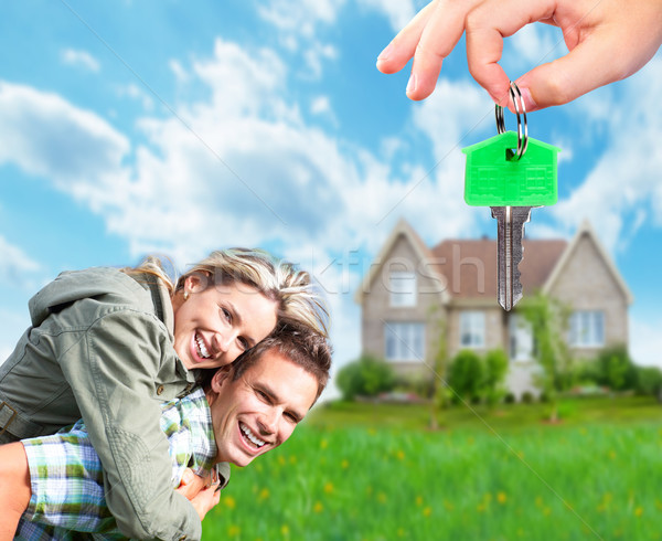 Stock photo: Couple near new house.