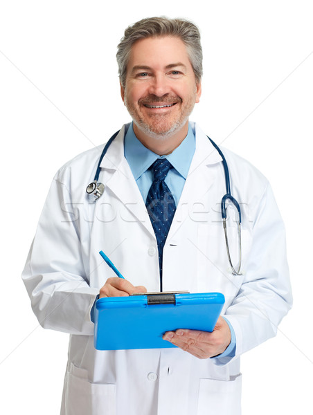 Doctor pharmacist writing on clipboard. Stock photo © Kurhan