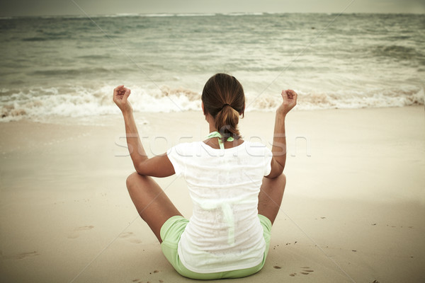 Woman doing yoga on Punta Cana beach. Stock photo © Kurhan
