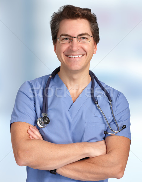 Smiling medical doctor man. Stock photo © Kurhan