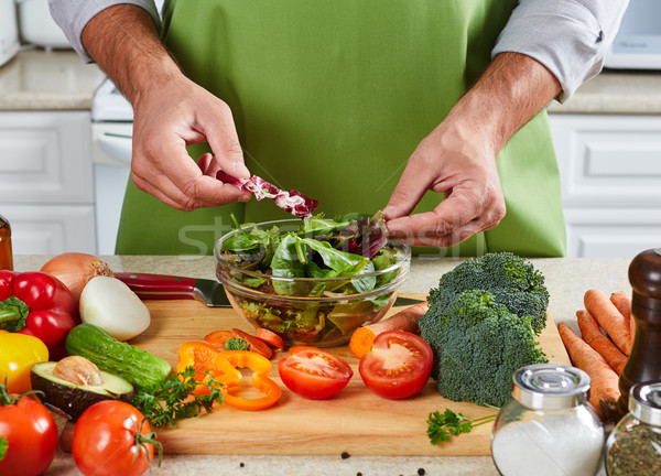 Chef man cooking in the kitchen. Stock photo © Kurhan