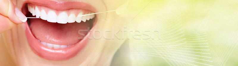 woman flossing teeth Stock photo © Kurhan