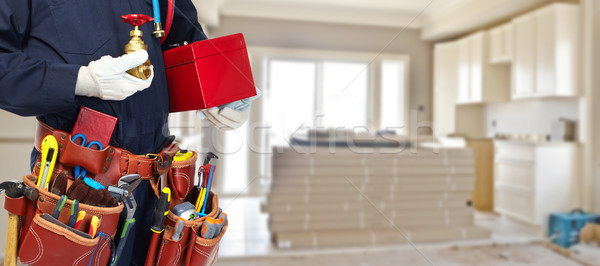 Builder handyman with construction tools. Stock photo © Kurhan