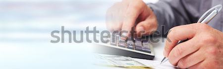 Stock photo: Accountant hands with calculator