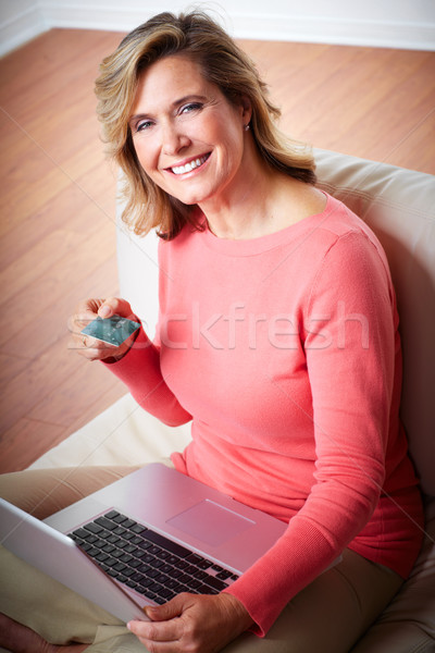Woman with laptop and a credit card. Stock photo © Kurhan