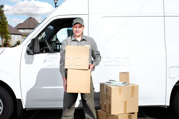 Lieferung Postdienst Mann glücklich professionelle Versandkosten Stock foto © Kurhan