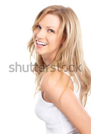 Feliz mulher belo jovem sorrindo isolado Foto stock © Kurhan