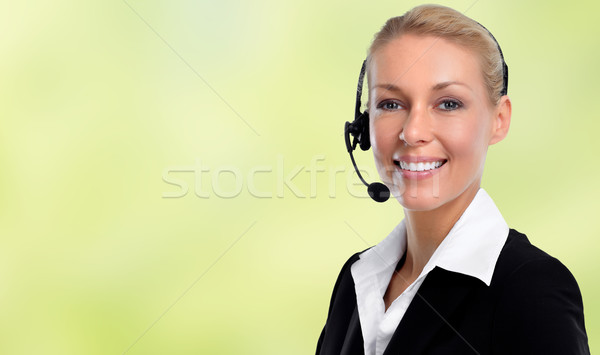 Smiling agent woman with headsets. Stock photo © Kurhan