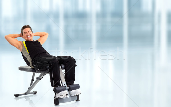 Young fitness man  on a exercise bench. Stock photo © Kurhan