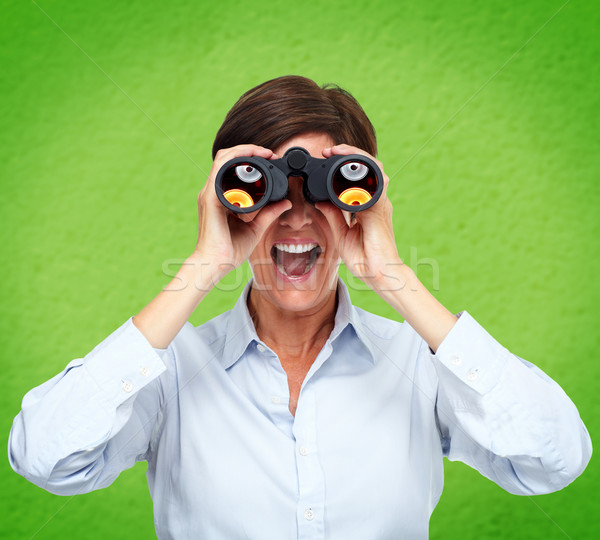 Business woman with binoculars. Stock photo © Kurhan