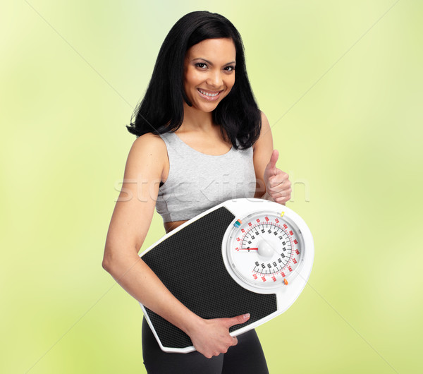 Beautiful Asian woman over green background. Stock photo © Kurhan