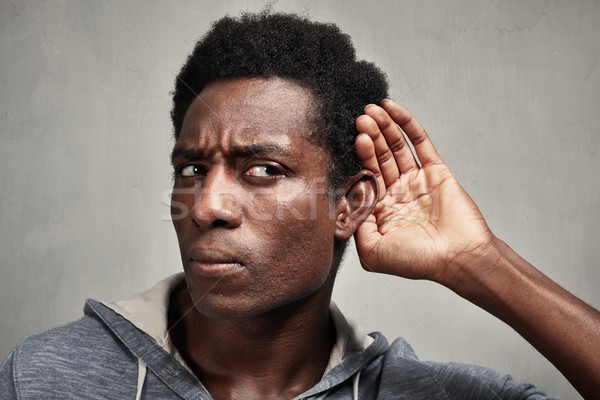 Hallgat afroamerikai férfi kéz mögött fül hallgatózás Stock fotó © Kurhan