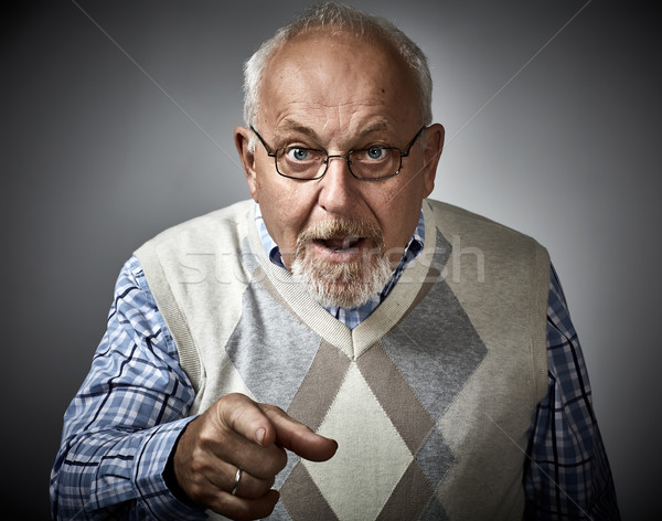 Old man pointing to the camera. Stock photo © Kurhan