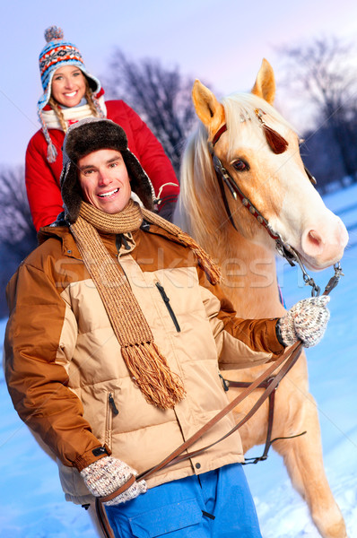 Couple cheval jeunes heureux souriant sports d'hiver [[stock_photo]] © Kurhan