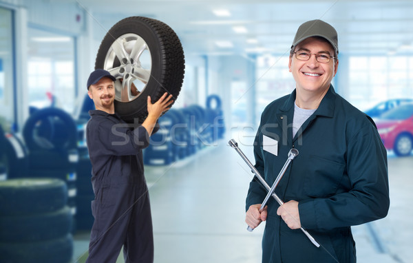 Car mechanic  with tire wrench. Stock photo © Kurhan