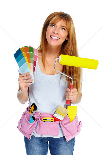 Stock photo: Woman with a painting roller.