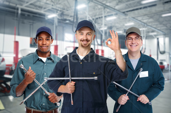 Car mechanic  with tire wrench. Stock photo © Kurhan