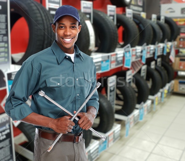 Car mechanic with tire wrench. Stock photo © Kurhan