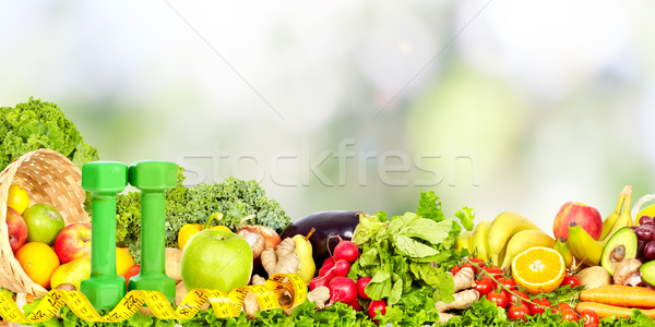 Vegetables and fruits over abstract background. Stock photo © Kurhan