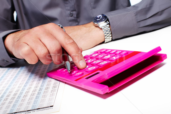 Hand of a businessman with calculator. Stock photo © Kurhan