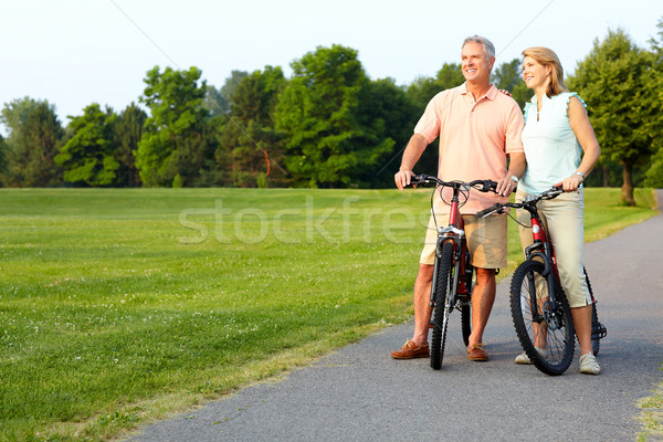Starszy para rowerowe szczęśliwy starszych parku fitness Zdjęcia stock © Kurhan