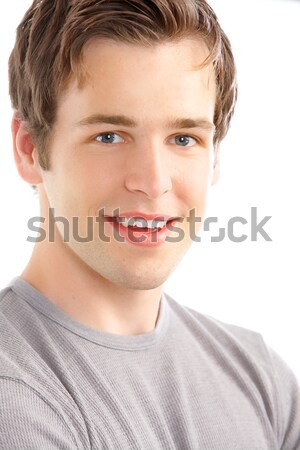 Jonge man knap glimlachend geïsoleerd witte glimlach Stockfoto © Kurhan