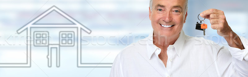 Senior man with house key. Stock photo © Kurhan