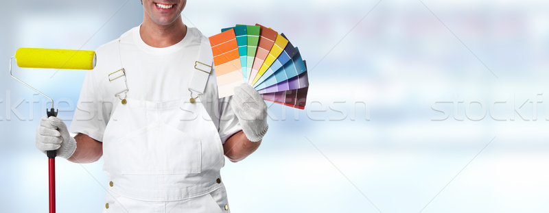 Painter with painting roller Stock photo © Kurhan