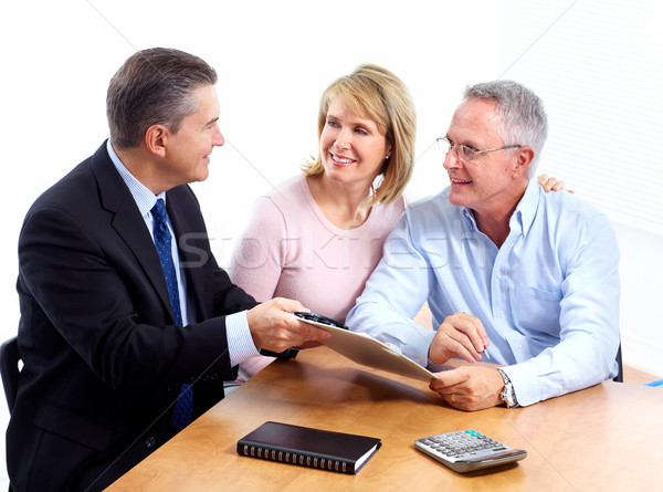Senior couple with financial adviser. Stock photo © Kurhan