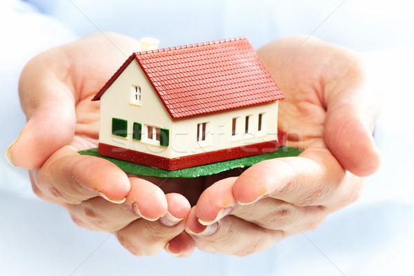 Hands with little house. Stock photo © Kurhan