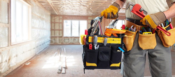 Builder handyman with construction tools. Stock photo © Kurhan