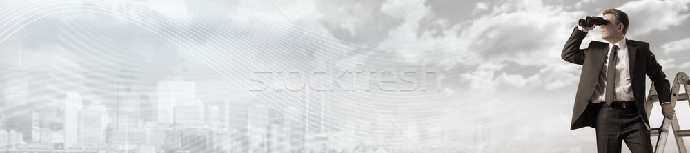 Businessman with binoculars. Stock photo © Kurhan