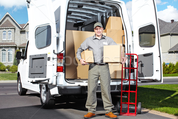 Lieferung Postdienst Mann glücklich professionelle Versandkosten Stock foto © Kurhan